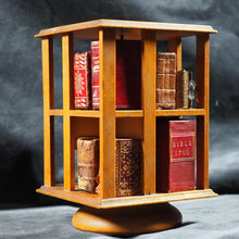 Load image into Gallery viewer, Revolving Bookcase. Slim, revolving, sycamore bookcase for miniature books. 1904.
