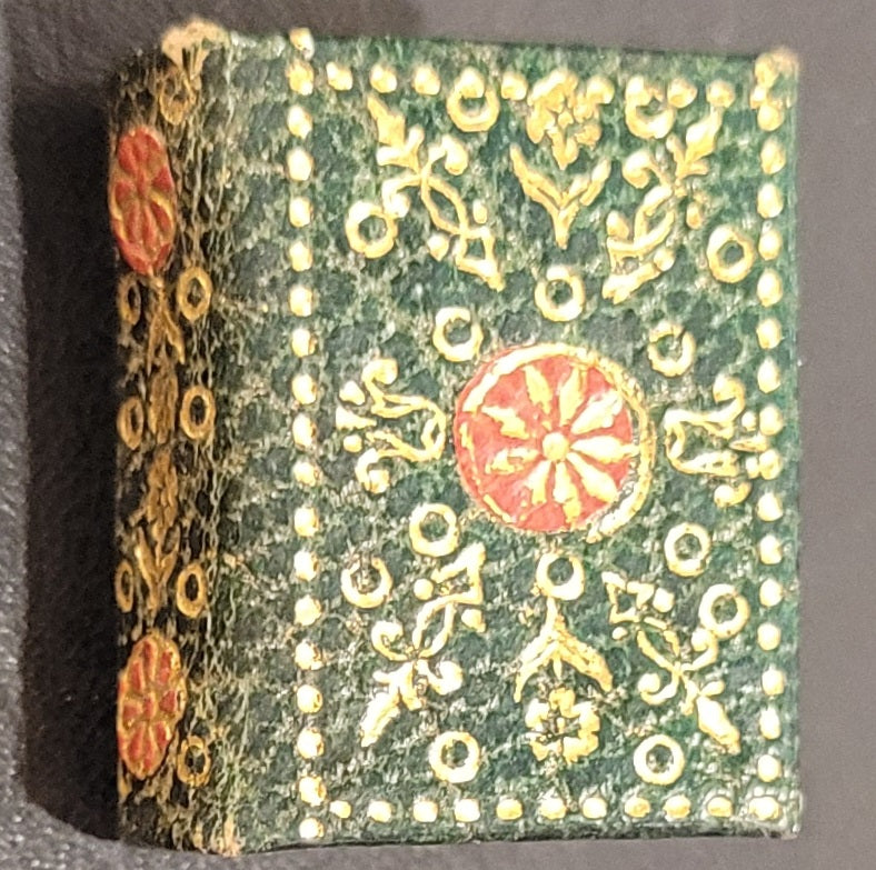 New Testament. c1896)     Bound in charcoal leather with gilt edges, extensive floral     gilt and red to cover